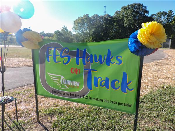A ribbon being cut for a new track at FES.